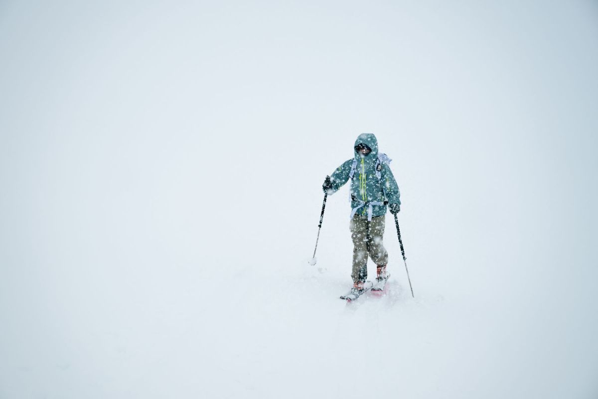 a skier wearing gore-tex epe in heavy snow