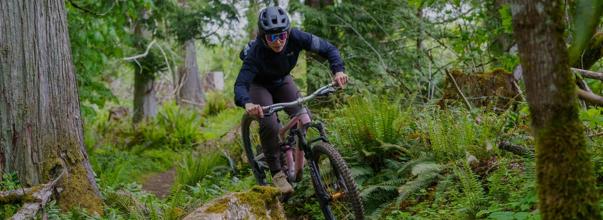 women mountain biker shredding