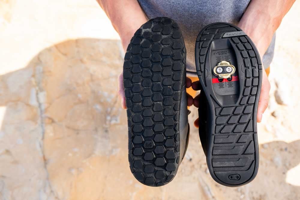 Side by side comparison of flat soled MTB shoes and clipless MTB shoes.