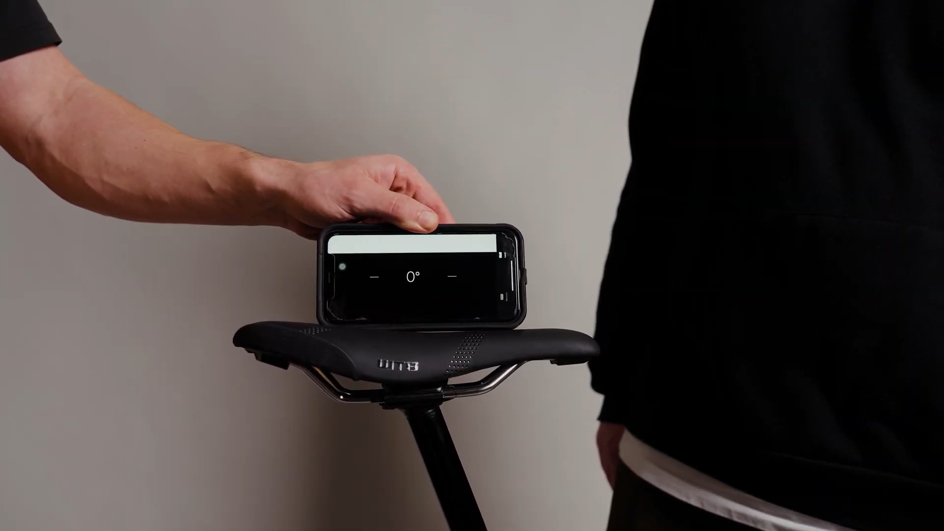 Using the iPhone Bubble Level app to set MTB saddle angle.