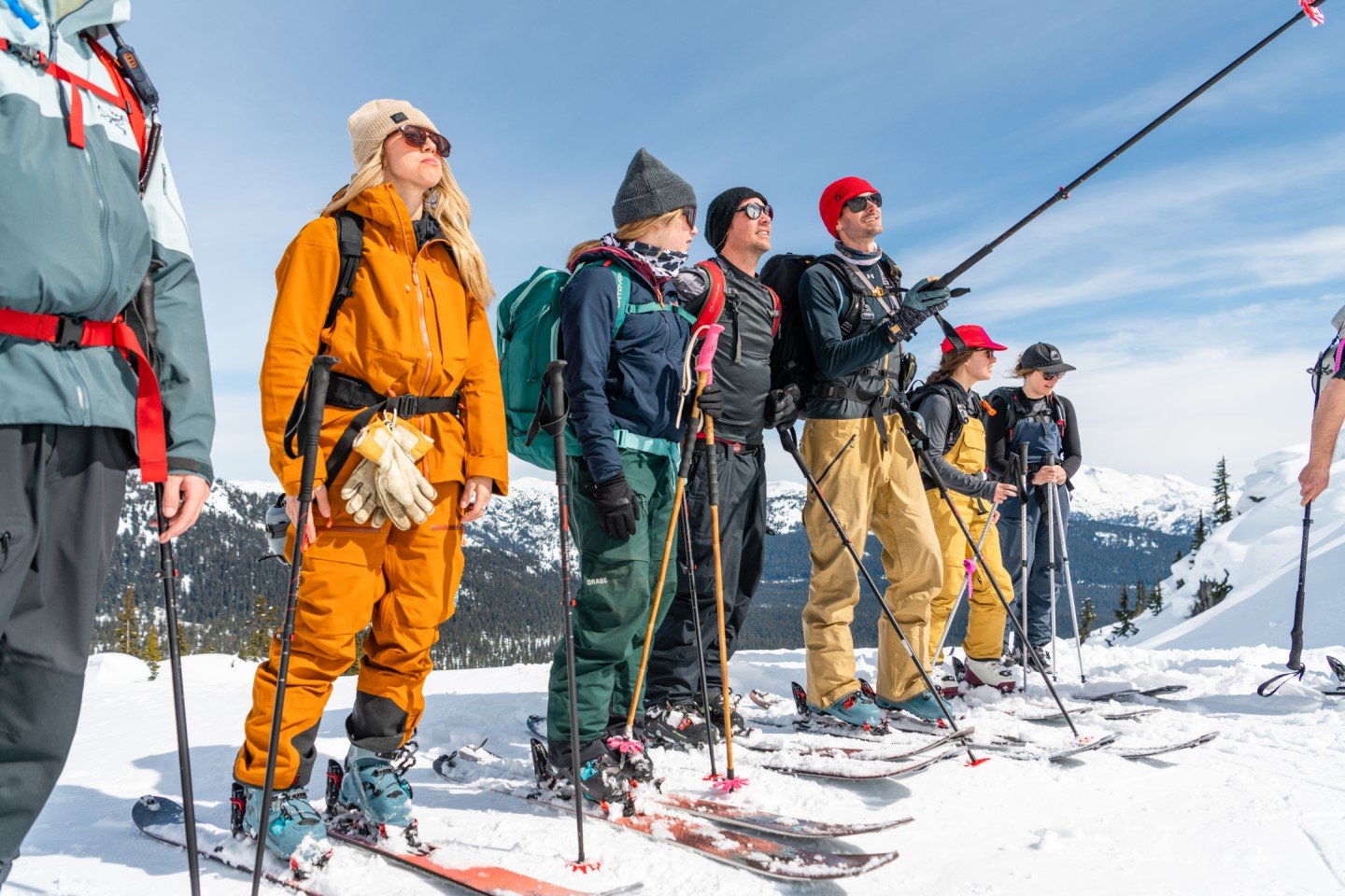 A photo of skiers taking a selfie in the mountains